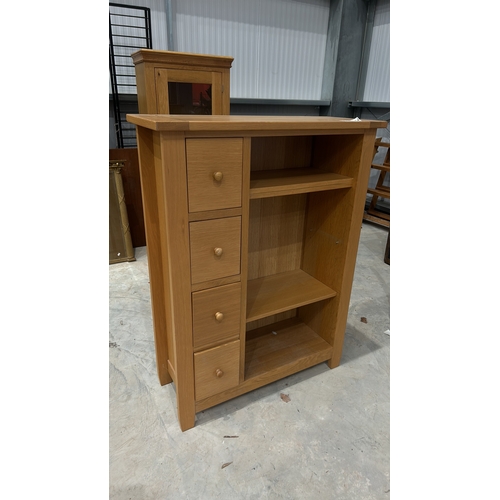 63 - A modern Con-tempo oak cabinet/ Bookshelf featuring 4 drawers and open shelves