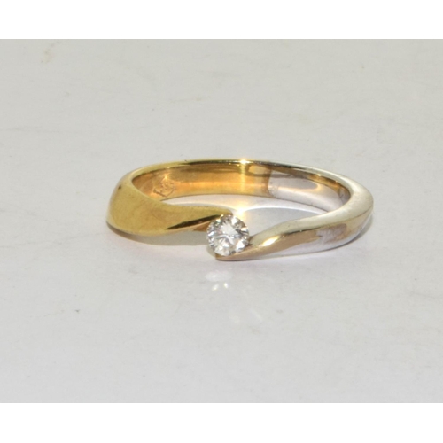 502 - A 14ct white and yellow Gold & Diamond solitaire ring.Size - NWeight - 3.39