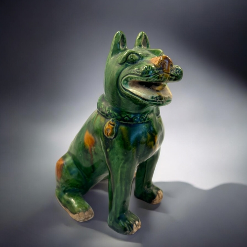 132 - A pair of Chinese Sancai glazed dogs.In the Tang style.Height - 19cm