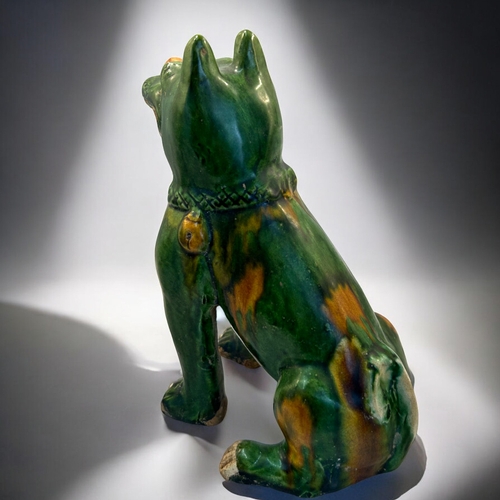 132 - A pair of Chinese Sancai glazed dogs.In the Tang style.Height - 19cm