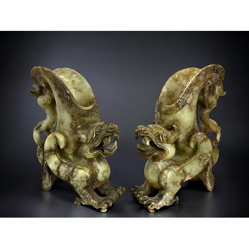 136 - A pair of Chinese carved hardstone Pixiu figures.Height - 20cm