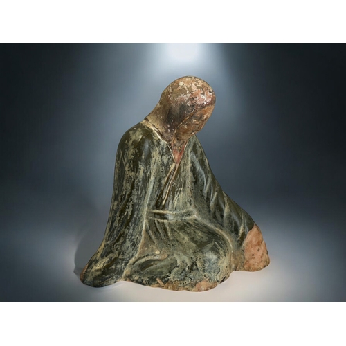 138 - A Chinese green glazed figure of a kneeling, robed woman.In the Northern dynasties style.Height - 20... 