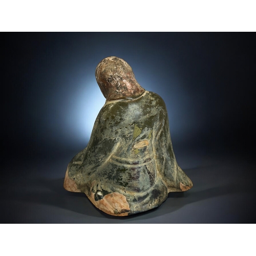 138 - A Chinese green glazed figure of a kneeling, robed woman.In the Northern dynasties style.Height - 20... 