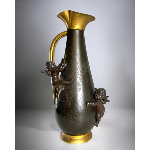 140 - A large French Bronze and gilt metal ewer.France, Circa 1890.Foliate etched design, with mounted hig... 