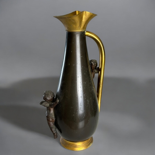 140 - A large French Bronze and gilt metal ewer.France, Circa 1890.Foliate etched design, with mounted hig... 