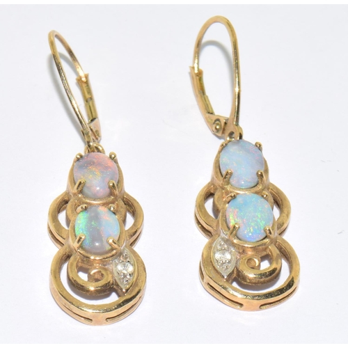 5 - 9ct gold Opal and Diamond  pendant necklace and Earrings suite of jewellery set on a 44cm gold chain... 