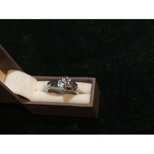 320 - 925 silver ring with a heart shape and bow tie logo size R