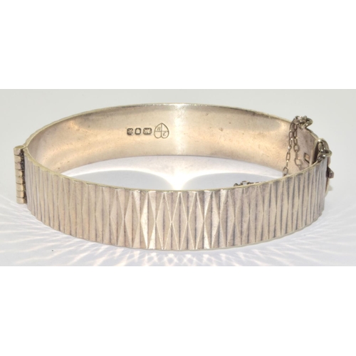 327 - 925 silver Hallmarked bracelet with a bark pattern and safety chain 25g