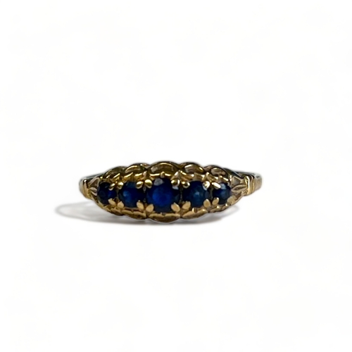 342A - Antique Ladies 9CT Gold Ring. Set with five graduating blue gemstones. UK size - L 1/2