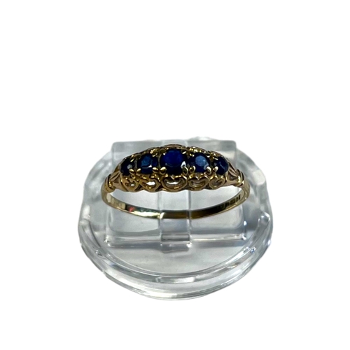 342A - Antique Ladies 9CT Gold Ring. Set with five graduating blue gemstones. UK size - L 1/2