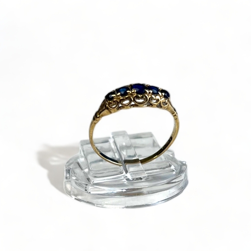 342A - Antique Ladies 9CT Gold Ring. Set with five graduating blue gemstones. UK size - L 1/2