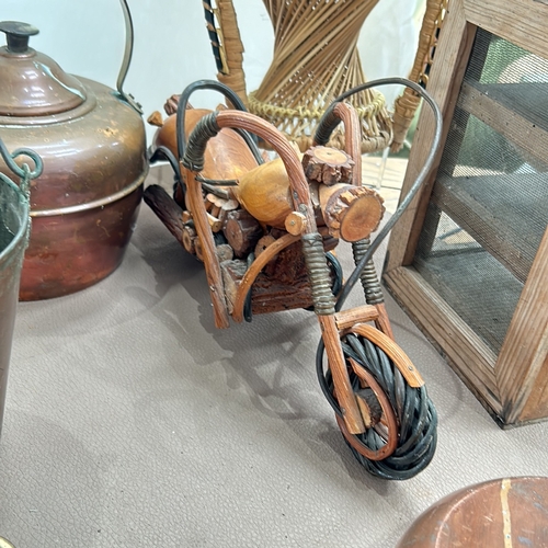 344 - Mixed lot featuring a rustic wooden motorcycle sculpture, copper kettle, vintage barometers, rattan ... 