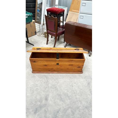 345 - Wooden storage chest with iron hinges and latch, featuring a rustic pine finish, from the mid-centur... 