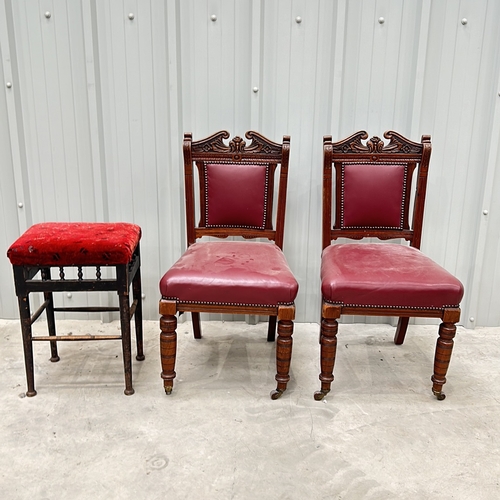 272 - Victorian-style mahogany chairs, set of two, feature red leather upholstery and decorative carving. ... 