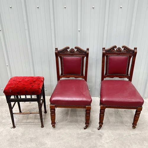 272 - Victorian-style mahogany chairs, set of two, feature red leather upholstery and decorative carving. ... 