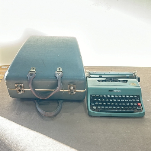 289 - Vintage Olivetti Lettera 32 typewriter, iconic portable design, from the 1960s. Mint green casing wi... 