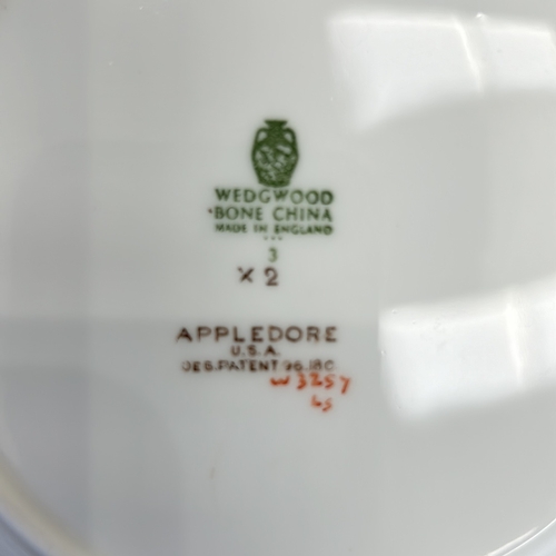 294 - Vintage WEDGWOOD APPLEDORE porcelain dinnerware set featuring floral motifs and gold trim. Includes ... 