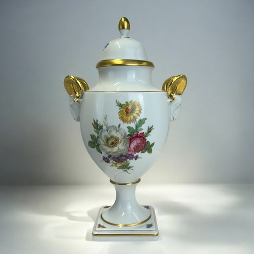 149 - A Kaiser porcelain lidded vase.Foliate sprays, with twin gilded ram handles. Height - 32cm ... 