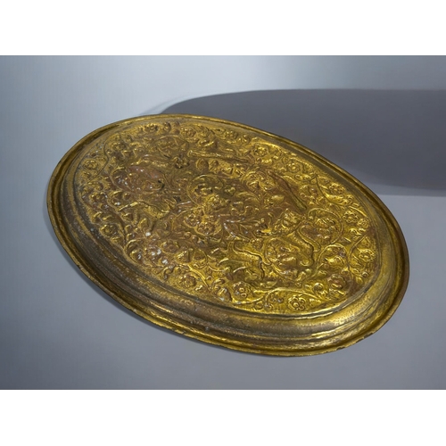 153 - A 19th century Persian gilded copper tray.Repousse decorated with animals amongst foliate design.36 ... 