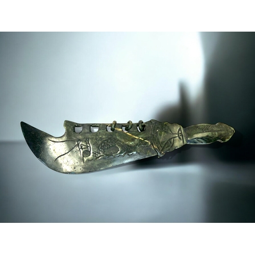 164 - A Chinese carved hardstone ceremonial dagger.Carved Dragons to each side with Taotie hilt. Length - ... 