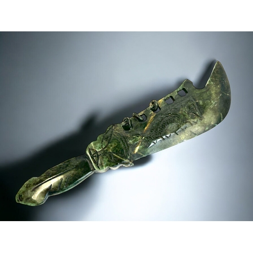 164 - A Chinese carved hardstone ceremonial dagger.Carved Dragons to each side with Taotie hilt. Length - ... 