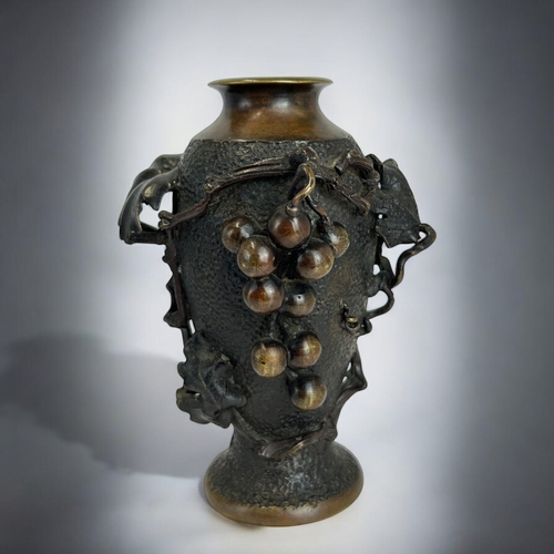 166 - A Japanese Bronze vase.Meiji period, CA 1900.High relief decorated 'Grape & Vine'.Marked to base... 