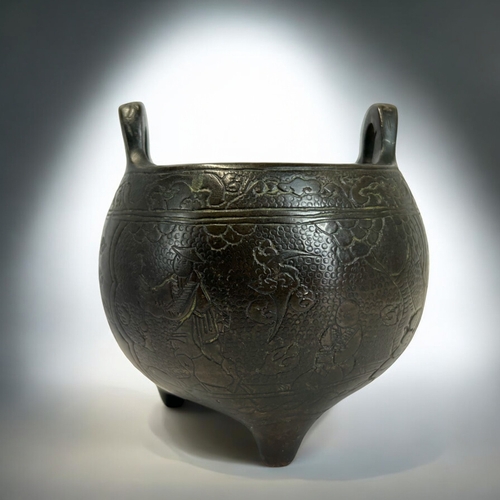 228 - A Chinese bronze tripod censer.Globular form, engraved with various scenes, including a warrior on h... 