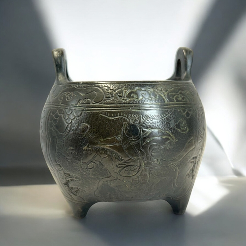 228 - A Chinese bronze tripod censer.Globular form, engraved with various scenes, including a warrior on h... 