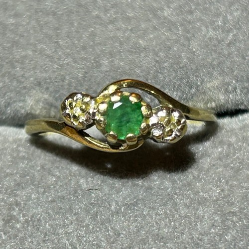 354 - A 9ct gold diamond and emerald three stone ring, approx UK size M, 2g