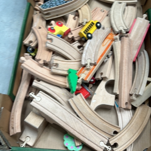 370 - Mixed lot of wooden train track pieces, including curved and straight sections, bridges, and assorte... 