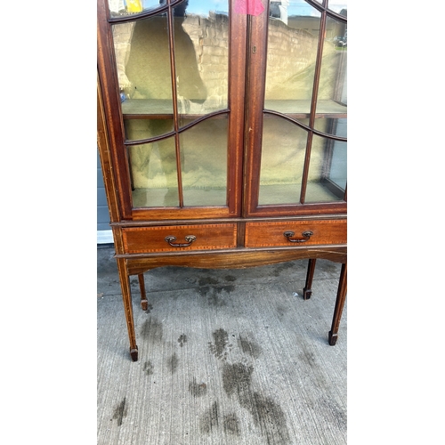 364 - Mahogany display cabinet with glass doors, curved pediment, and decorative inlay. Approximately 200 ... 