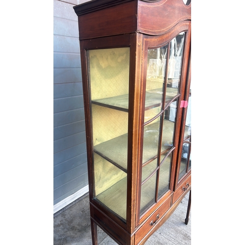 364 - Mahogany display cabinet with glass doors, curved pediment, and decorative inlay. Approximately 200 ... 