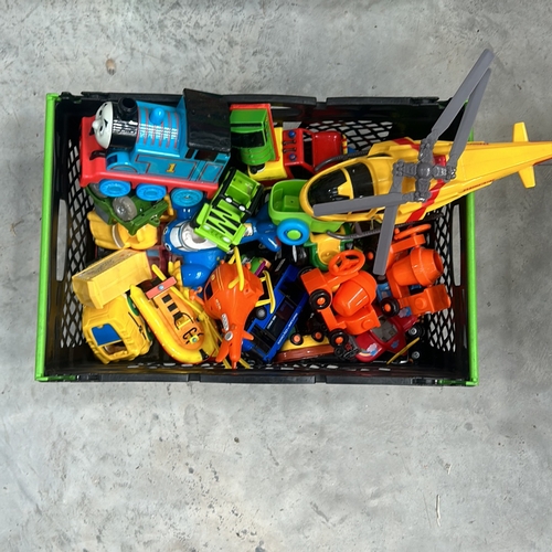 374 - Collection of colorful plastic toys, including helicopters, trains, and vehicles. Assorted designs.