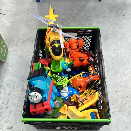 374 - Collection of colorful plastic toys, including helicopters, trains, and vehicles. Assorted designs.