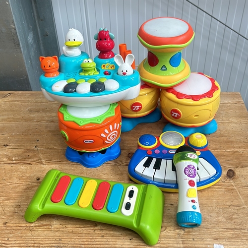 376 - Little Tikes musical toy set includes a keyboard, microphone, and xylophone in bright colors.