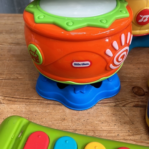 376 - Little Tikes musical toy set includes a keyboard, microphone, and xylophone in bright colors.