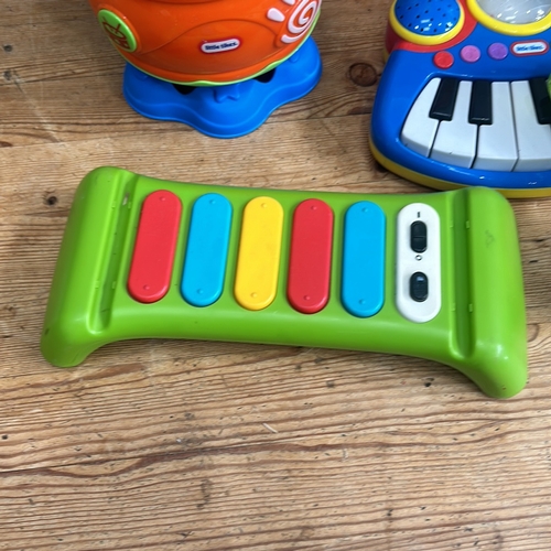 376 - Little Tikes musical toy set includes a keyboard, microphone, and xylophone in bright colors.