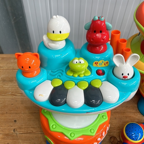 376 - Little Tikes musical toy set includes a keyboard, microphone, and xylophone in bright colors.