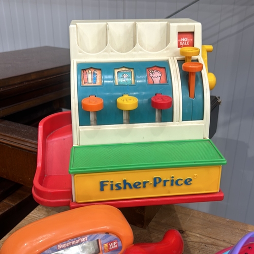 378 - Vintage Fisher-Price toy set featuring playhouses and accessories. Includes various colorful plastic... 