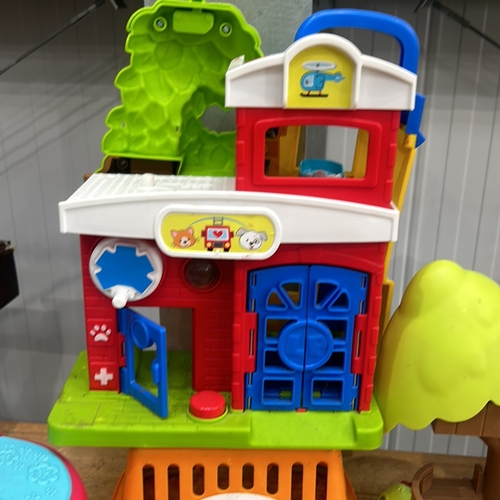 378 - Vintage Fisher-Price toy set featuring playhouses and accessories. Includes various colorful plastic... 