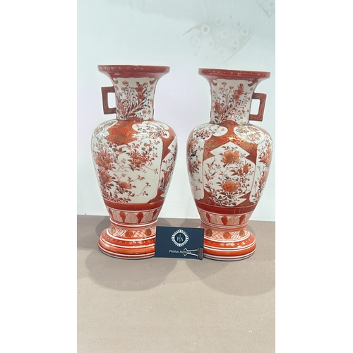 382 - A pair of Japanese Meiji Period Kutani  porcelain vase with floral and geometric motifs, featuring r... 