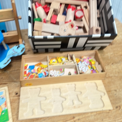 385 - Wooden construction and play set features natural and colorful blocks, including a bench with pegs a... 