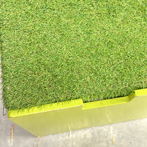 387 - Bright green storage box with artificial grass lid. Approximately 30 inches tall, 40 inches wide, an... 