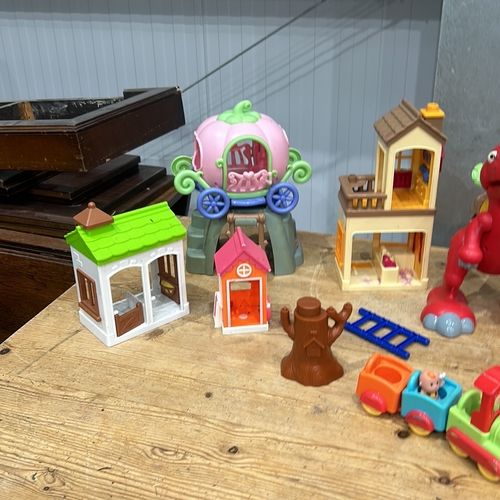 407 - Assorted plastic playset including carousel, dinosaur, train, and houses. Includes Pop-Up Pirate gam... 