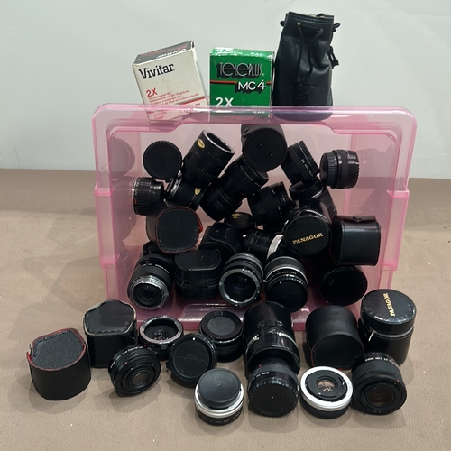 392 - Collection of vintage camera lenses, including Vivitar and Panagor brands, with storage cases. Assor... 