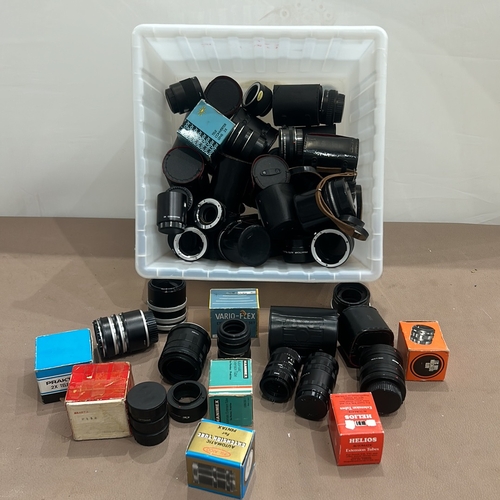 393 - Collection of vintage camera lenses and accessories, featuring brands like Tamron, Hanimex, and Heli... 