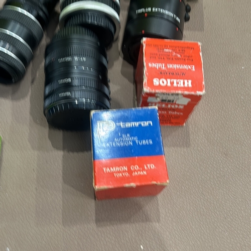 395 - Collection of vintage camera extension tubes and adapters. Brands include Asahi Pentax, Zenit, Vivit... 