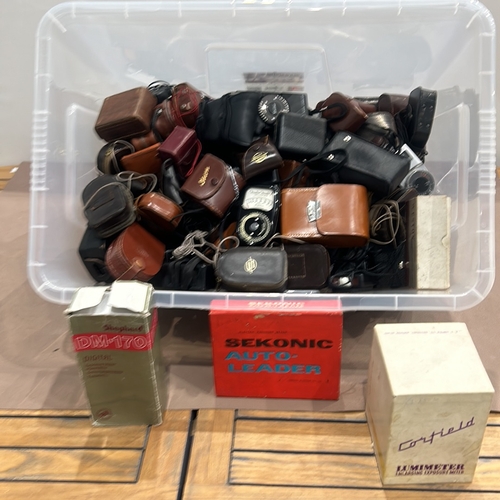 397 - Collection of vintage light meters and accessories in leather cases, including Weston brand, stored ... 