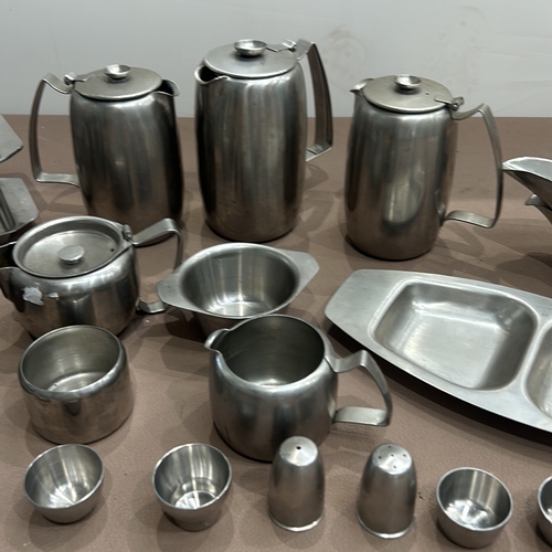 402 - Mid-Century Modern stainless steel tea and coffee set by Old Hall. Includes teapots, sugar bowl, mil... 