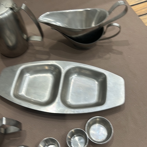 402 - Mid-Century Modern stainless steel tea and coffee set by Old Hall. Includes teapots, sugar bowl, mil... 